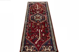 Surface texture of 2000s Shiraz rug with natural Wool and intricate pattern