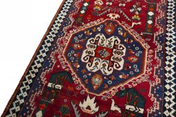 Backside of handmade 2000s Shiraz rug showing knot structure and weave density