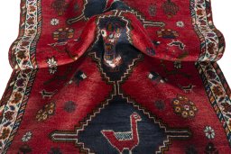 Corner detail of 2000s Shiraz rug showing border pattern and Wool pile