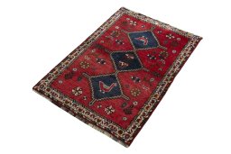 Corner detail of 2000s Shiraz rug showing border pattern and Wool pile