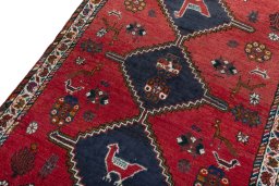Backside of handmade 2000s Shiraz rug showing knot structure and weave density
