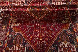 Corner detail of 2000s Shiraz rug showing border pattern and Wool pile