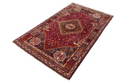 Corner detail of 2000s Shiraz rug showing border pattern and Wool pile