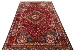 Surface texture of 2000s Shiraz rug with natural Wool and intricate pattern
