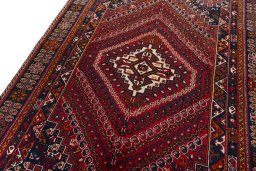 Backside of handmade 2000s Shiraz rug showing knot structure and weave density