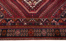 Full view of 2000s Shiraz rug from Iran / Persia, 257 × 176 cm in Red tones