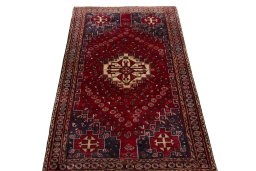 Surface texture of 2000s Shiraz rug with natural Wool and intricate pattern