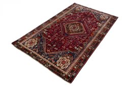 Corner detail of 2000s Shiraz rug showing border pattern and Wool pile