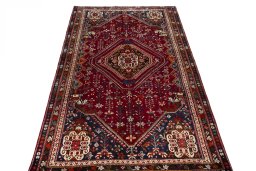 Surface texture of 2000s Shiraz rug with natural Wool and intricate pattern