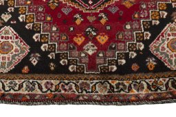 Central medallion detail of 2000s Shiraz rug from Iran / Persia