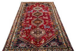 Surface texture of 2000s Shiraz rug with natural Wool and intricate pattern
