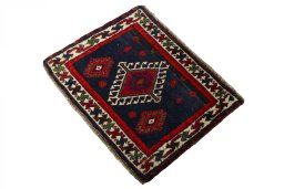Corner detail of 2000s Shiraz rug showing border pattern and Wool pile