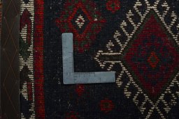 Backside of handmade 2000s Shiraz rug showing knot structure and weave density