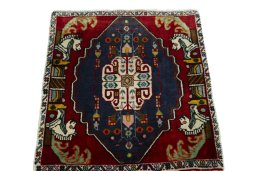 Surface texture of 2000s Shiraz rug with natural Wool and intricate pattern