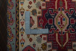Backside of handmade 2000s Shiraz rug showing knot structure and weave density