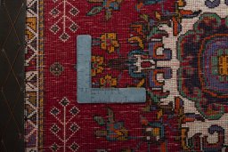 Backside of handmade 2000s Shiraz rug showing knot structure and weave density