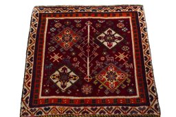 Surface texture of 2000s Shiraz rug with natural Wool and intricate pattern