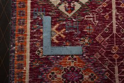 Backside of handmade 2000s Shiraz rug showing knot structure and weave density