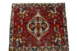 Surface texture of 2000s Shiraz rug with natural Wool and intricate pattern