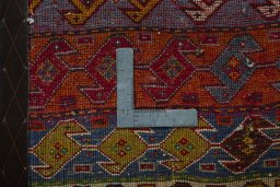 Backside of handmade 2000s Shiraz rug showing knot structure and weave density