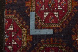 Backside of handmade 2000s Shiraz rug showing knot structure and weave density