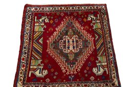 Surface texture of 2000s Shiraz rug with natural Wool and intricate pattern