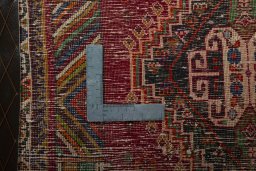 Backside of handmade 2000s Shiraz rug showing knot structure and weave density