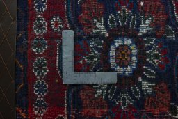 Backside of handmade 2000s Shiraz rug showing knot structure and weave density