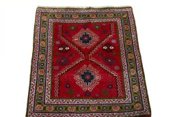 Surface texture of 2000s Shiraz rug with natural Wool and intricate pattern