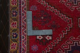 Backside of handmade 2000s Shiraz rug showing knot structure and weave density