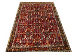 Surface texture of 2000s Shiraz rug with natural Wool and intricate pattern