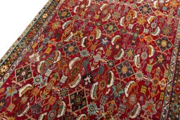 Backside of handmade 2000s Shiraz rug showing knot structure and weave density