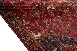 Corner detail of 2000s Shiraz rug showing border pattern and Wool pile
