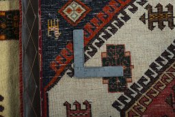 Corner detail of 2000s Shiraz rug showing border pattern and Wool pile