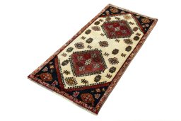Corner detail of 2000s Shiraz rug showing border pattern and Wool pile