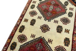 Backside of handmade 2000s Shiraz rug showing knot structure and weave density