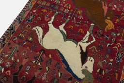 Backside of handmade 2000s Shiraz rug showing knot structure and weave density
