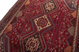 Backside of handmade 2000s Shiraz rug showing knot structure and weave density