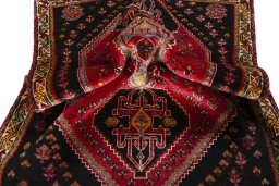 Corner detail of 2000s Shiraz rug showing border pattern and Wool pile