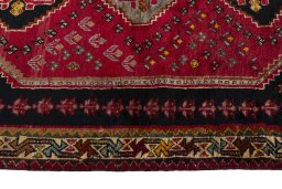 Close-up detail of 2000s Shiraz rug from Iran / Persia showing Wool weave