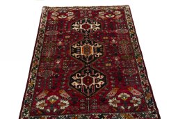 Surface texture of 2000s Shiraz rug with natural Wool and intricate pattern
