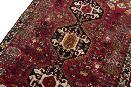 Backside of handmade 2000s Shiraz rug showing knot structure and weave density