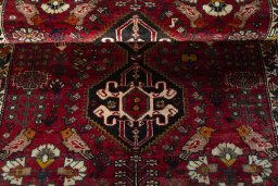 Full view of 2000s Shiraz rug from Iran / Persia, 154 × 108 cm in Red tones