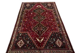 Surface texture of 2000s Shiraz rug with natural Wool and intricate pattern
