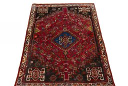Surface texture of 2000s Shiraz rug with natural Wool and intricate pattern