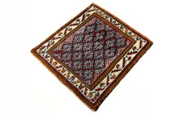 Corner detail of 2000s Shiraz rug showing border pattern and Wool pile