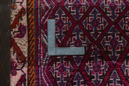 Backside of handmade 2000s Shiraz rug showing knot structure and weave density