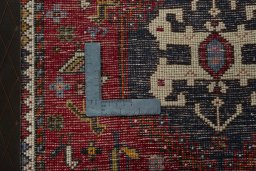 Backside of handmade 2000s Shiraz rug showing knot structure and weave density