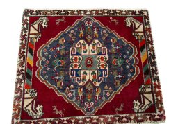 Surface texture of 2000s Shiraz rug with natural Wool and intricate pattern