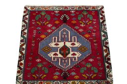 Surface texture of 2000s Shiraz rug with natural Wool and intricate pattern